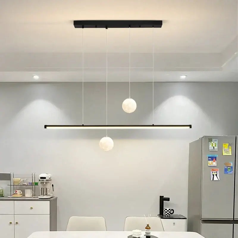 Modern black linear DecorBites LED pendant lights featuring two white globe fixtures for dining room and kitchen lighting