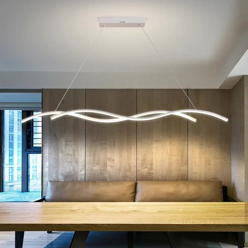 Modern white decorbites led pendant lights with sleek wavy design suspended above dining table for minimalist indoor lighting