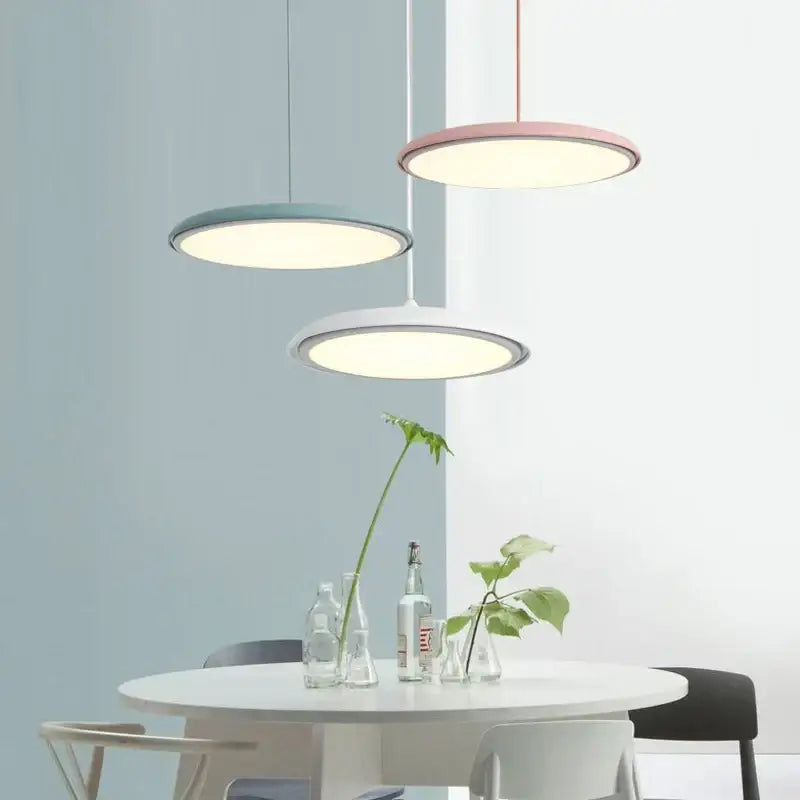 Three modern decorbites led pendant lights with matte pastel pink teal and white finish for kitchen bar living room