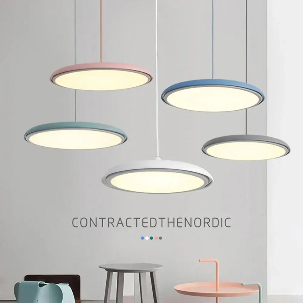 Modern circular DecorBites LED pendant lights in pastel colors with metallic rims for kitchen bar living room use