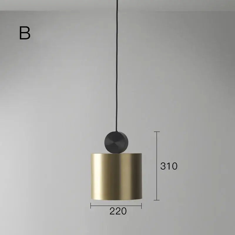 A sleek cylindrical decorbites led pendant light with brushed gold finish and matte black top for modern interiors
