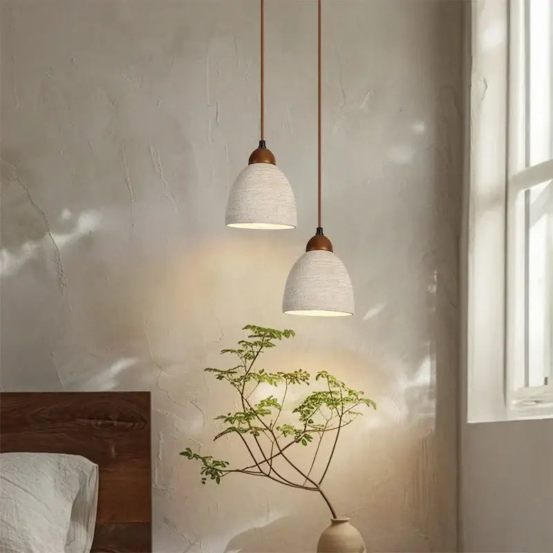 Two off-white textured ceramic pendant lights with wooden accents from decorbites led pendant lights collection
