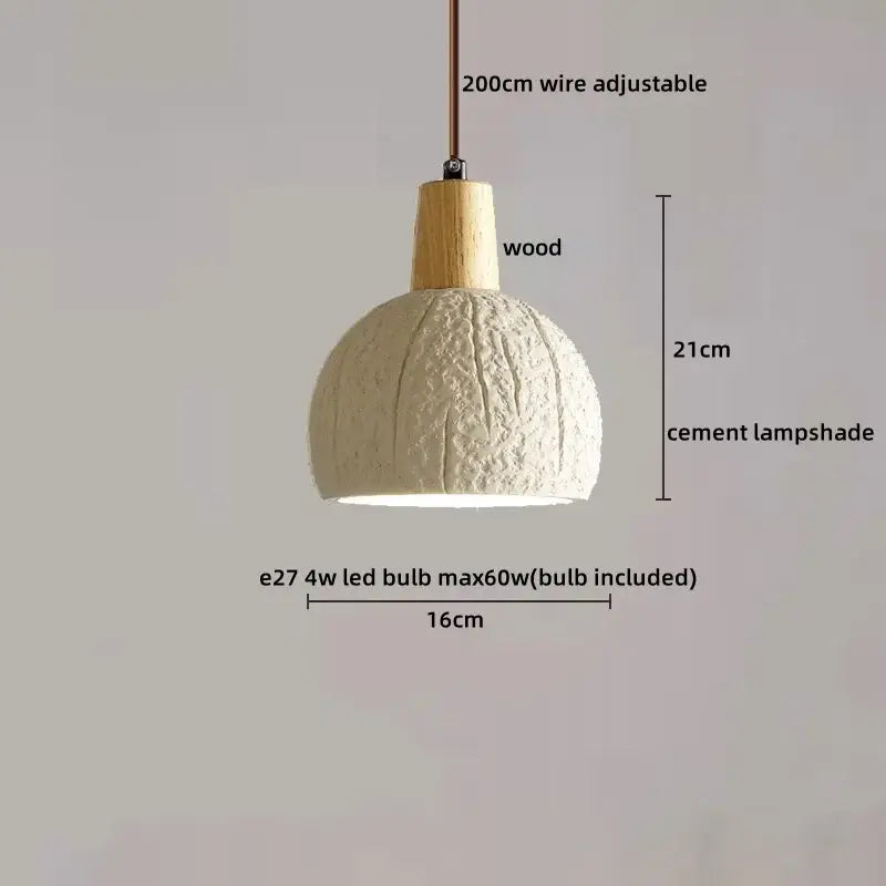 A decorbites led pendant light with an off-white cement shade and natural wood top suspended by adjustable wire