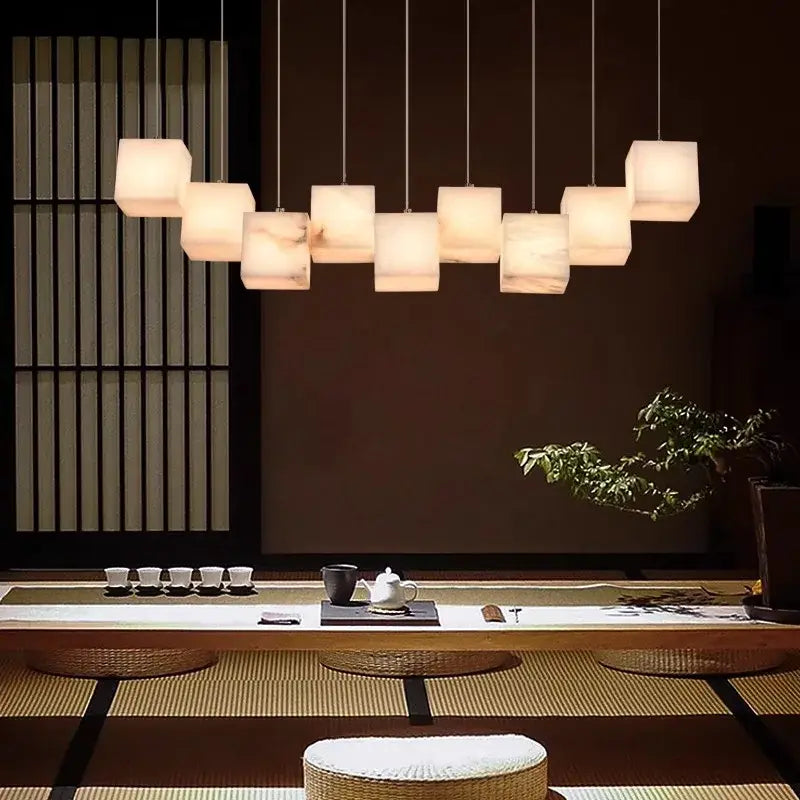 Modern decorbites led pendant lights featuring multiple softly glowing square cubes suspended by thin cords for indoor use