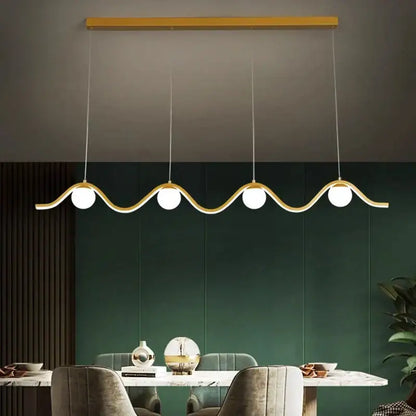 Modern gold-toned decorbites led pendant light with wavy design and four spherical bulbs for indoor lighting