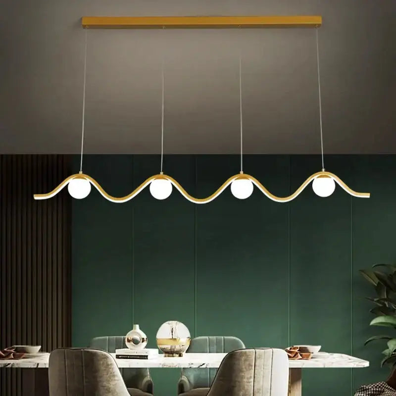 Modern gold-toned decorbites led pendant lights with sleek wavy design and four spherical bulbs for indoor lighting