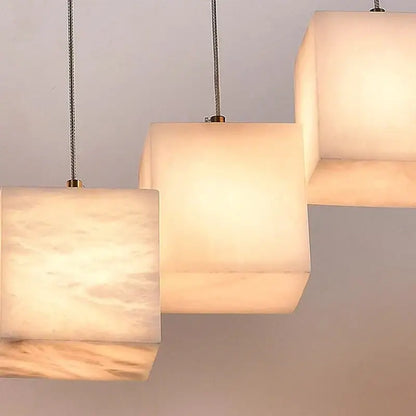 Modern rectangular decorbites led pendant lights with warm opaline marble shades and metallic braided cords for indoor lighting