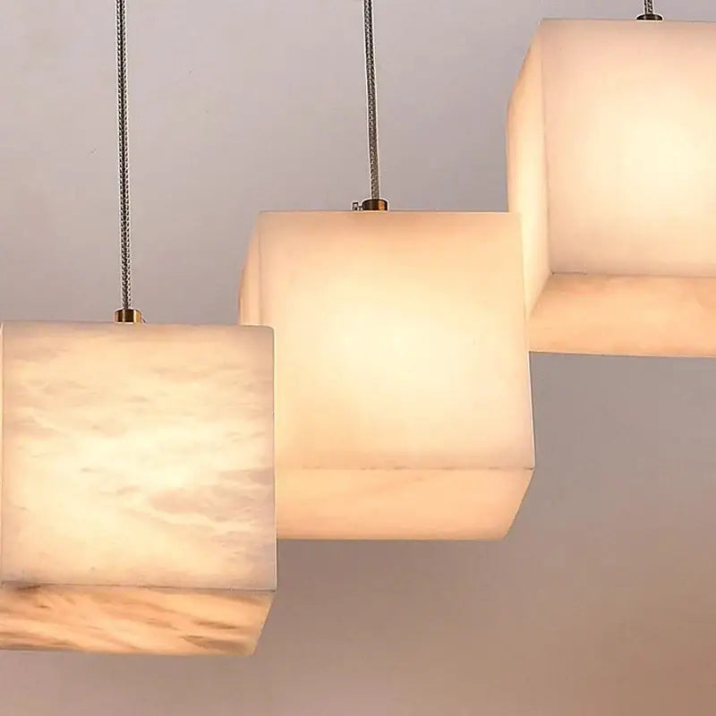 Modern rectangular decorbites led pendant lights with warm opaline marble shades and metallic braided cords for indoor lighting