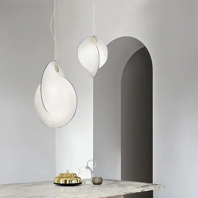 Two elegant white decorbites led pendant lights with gold accents for modern living and dining rooms