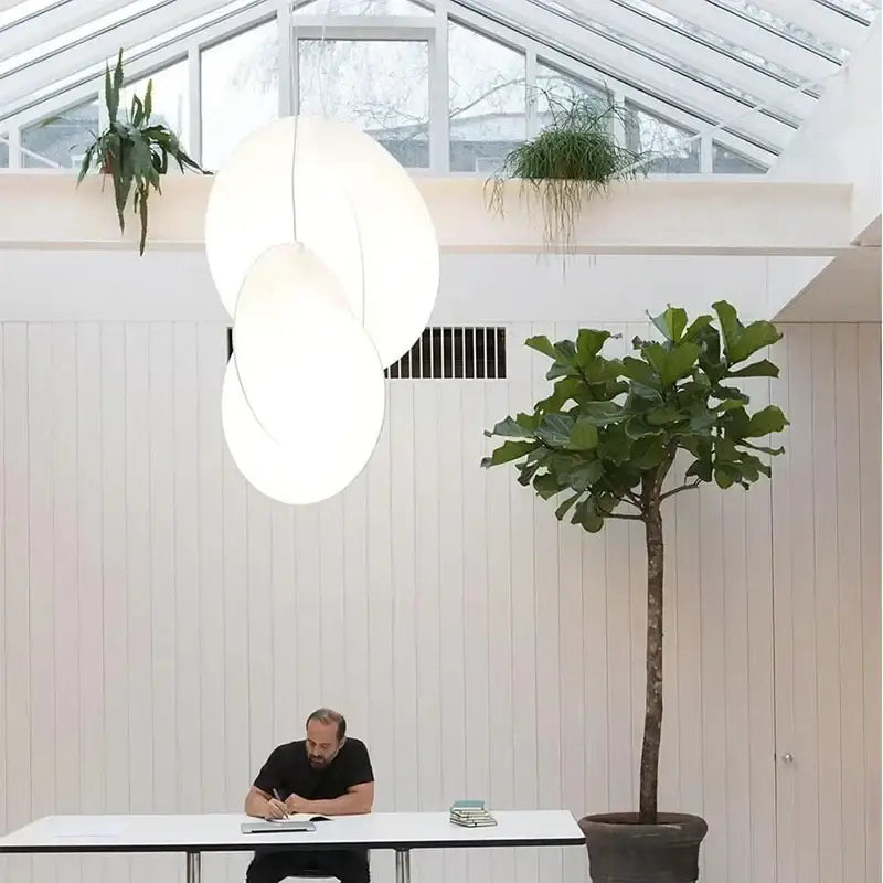 Modern white oval decorbites led pendant light with minimalist design hanging from ceiling for living and dining rooms