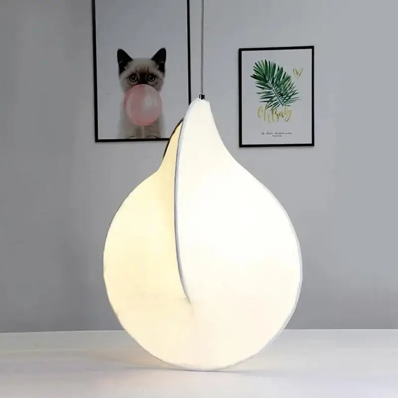 A modern teardrop-shaped decorbites led pendant light with soft white glow for living rooms and kitchens