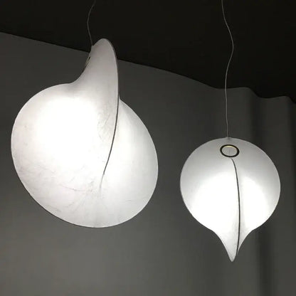 Two elegant white DecorBites led pendant lights with a soft glow for modern living dining rooms and kitchen lighting
