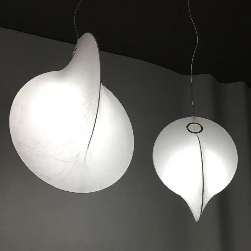 Two elegant white DecorBites led pendant lights with a soft glow for modern living dining rooms and kitchen lighting