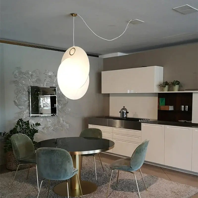Modern white oval pendant lights with gold-toned circular accent from decorbites led pendant lights collection