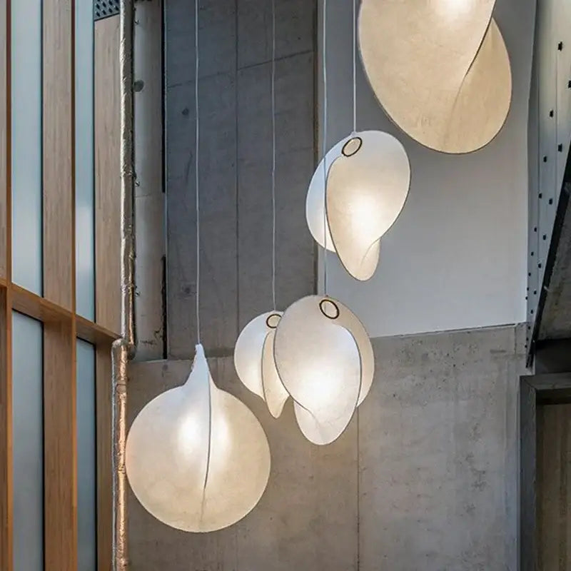 Delicate cream-colored decorbites led pendant lights with organic teardrop shapes for modern living spaces