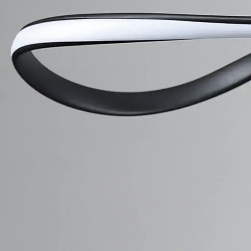 A sleek black and white decorbites led pendant lamp with curved design for modern living dining room lighting