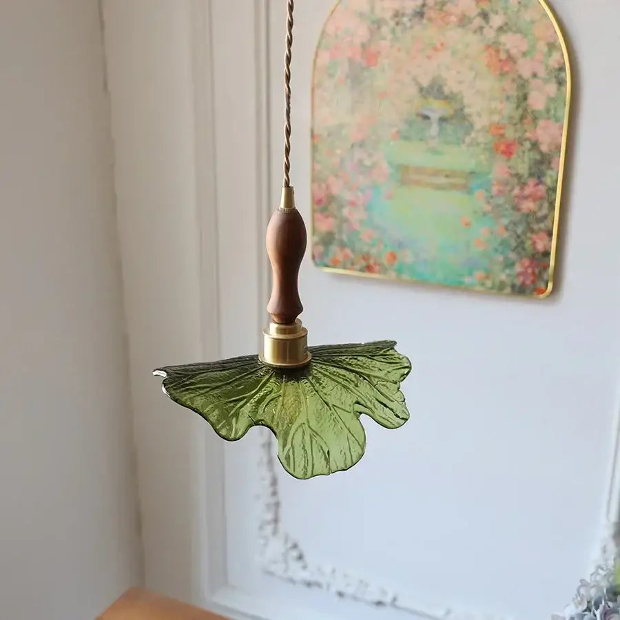DecorBites led pendant featuring a green glass leaf design with copper socket and walnut wood handle in Nordic modern style