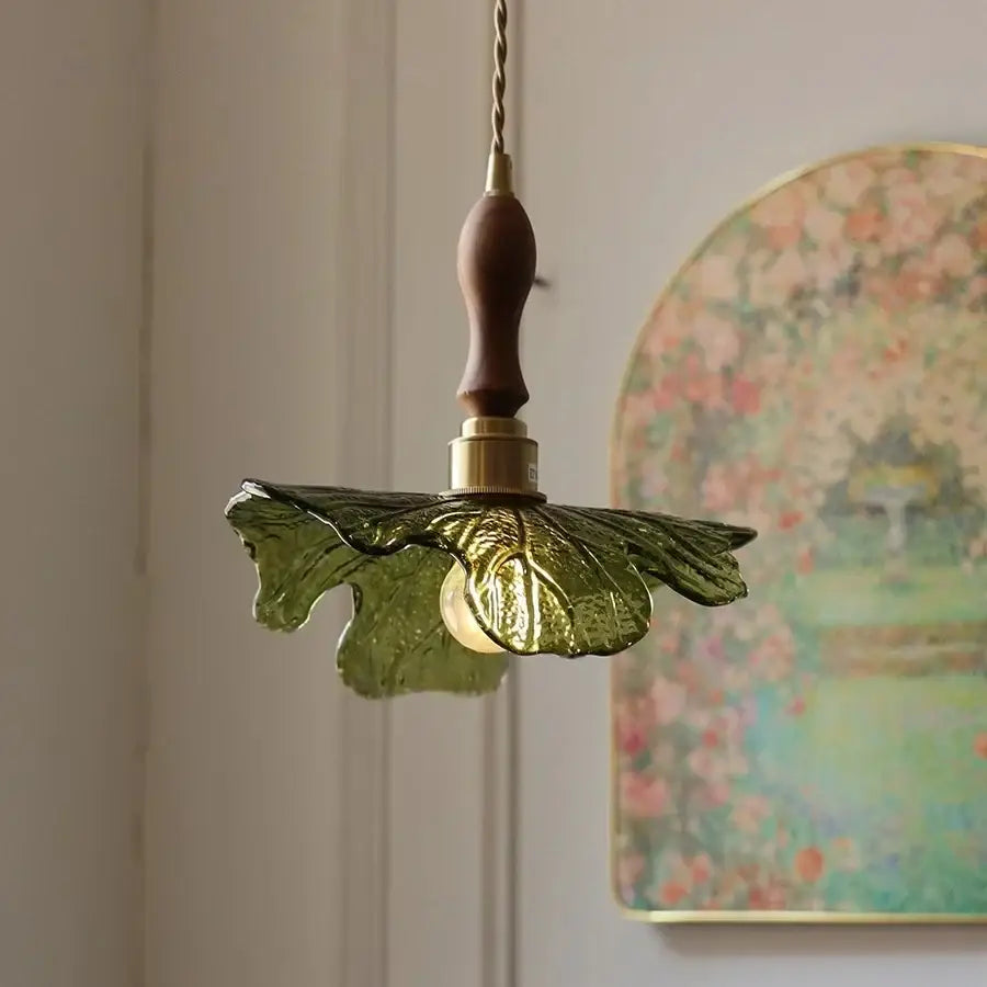 Green glass leaf-shaped decorbites led pendant light with walnut wood handle and brass accents in nordic modern style