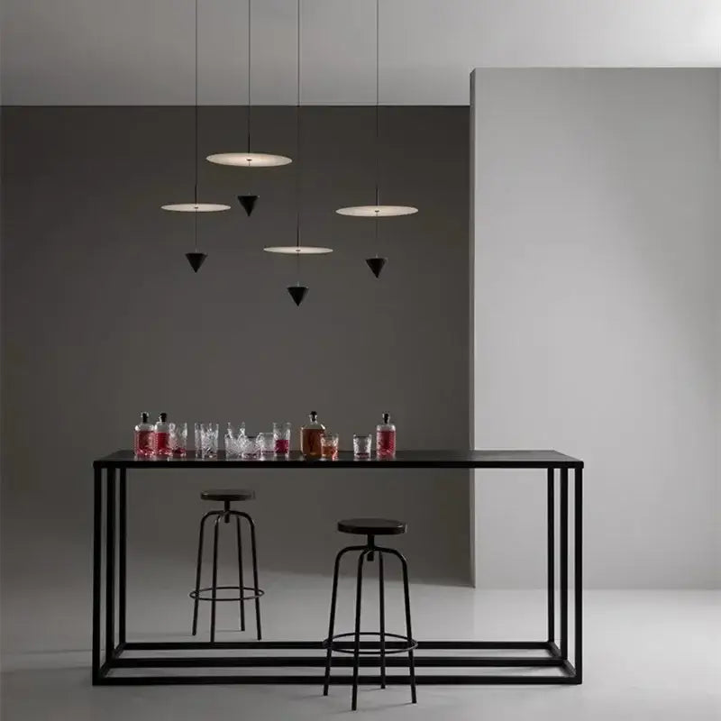 Modern black metal bar table with minimalist frame paired with decorbites led pendant lights for sleek home decor