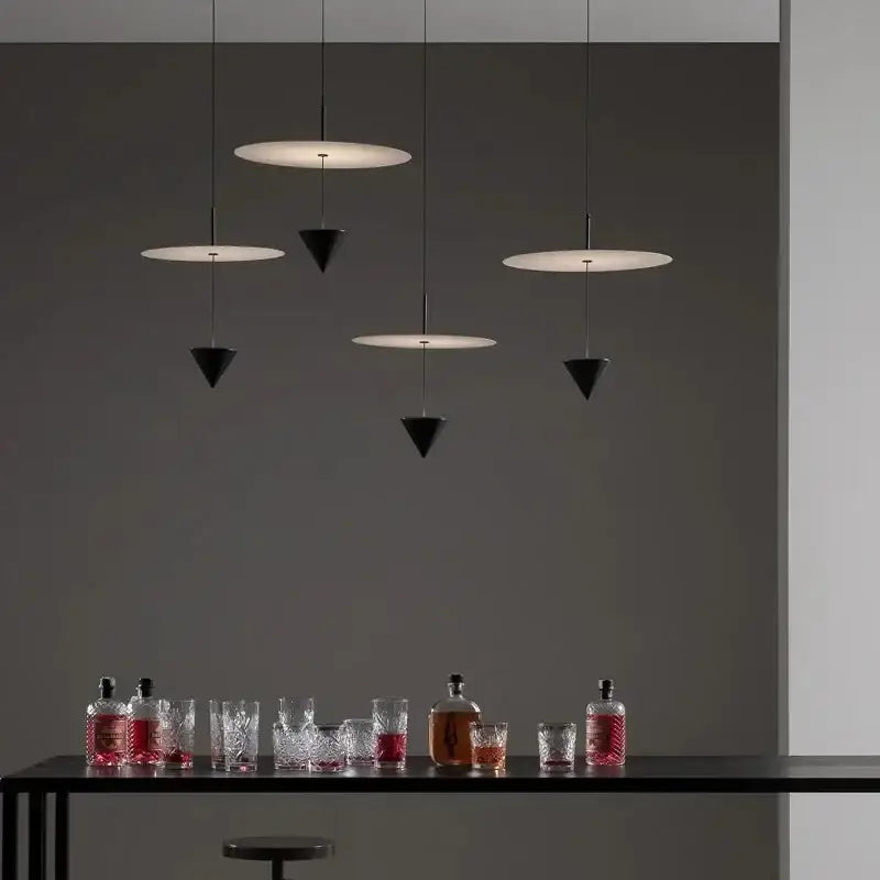 Modern minimalist decorbites led pendant lights with black and white geometric shapes hanging from thin cords
