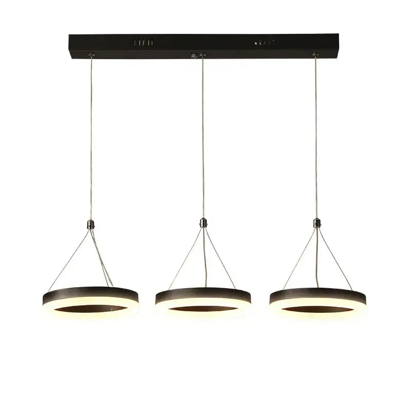 Modern black DecorBites LED pendant lights feature three illuminated acrylic rings suspended from a sleek ceiling mount