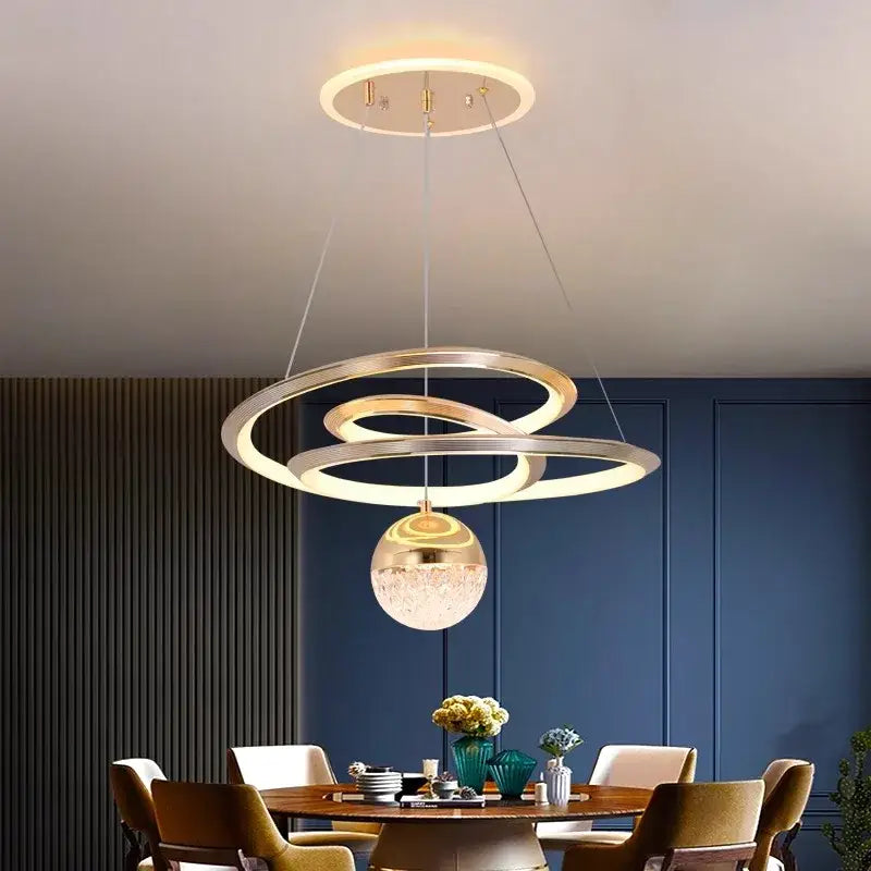 Modern gold-toned DecorBites LED pendant lights featuring a textured glass globe for living and dining room decor