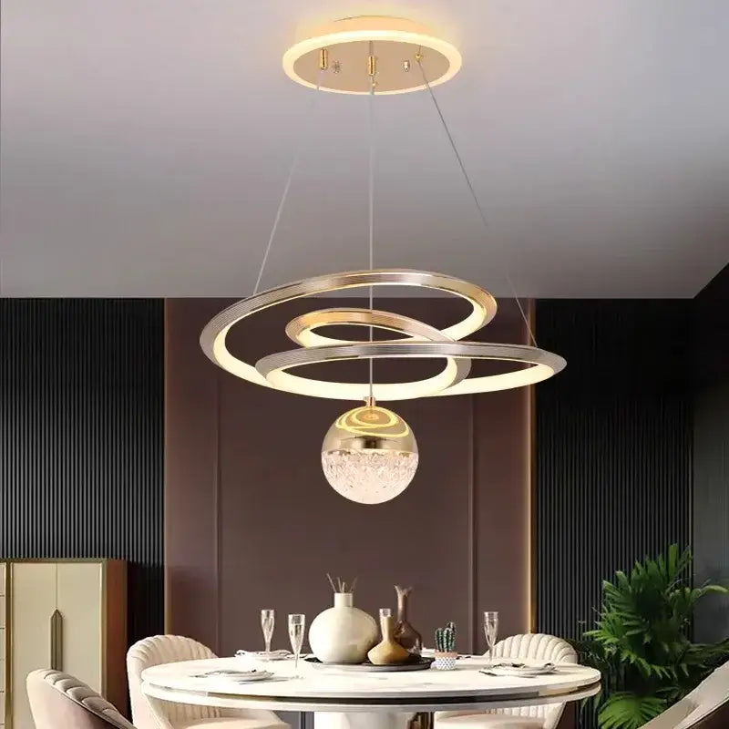 Modern gold-toned decorbites led pendant lights featuring a crystal-encrusted spherical LED pendant light for living room decor