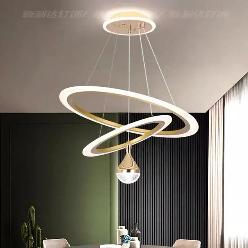 Modern gold and white double-ring LED pendant light with teardrop-shaped decorbites LED pendant for living room decor