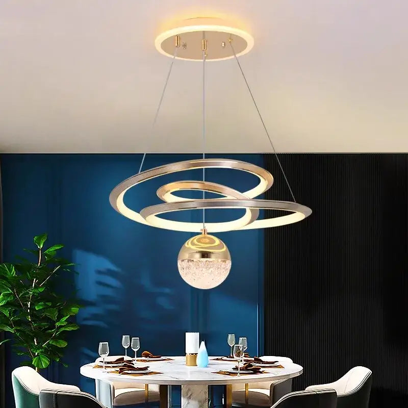 Modern gold-toned decorbites led pendant light with spiral design and crystal-encrusted globe for living room decor