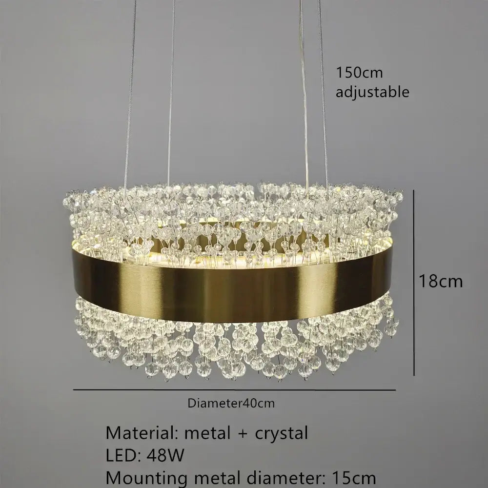 Elegant gold-toned decorbites led pendant lights with cascading crystal droplets and sleek metallic band for modern interiors