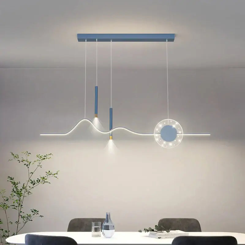 Modern blue and white decorbites led pendant lights featuring sleek cylindrical fixtures and illuminated circular element for dining