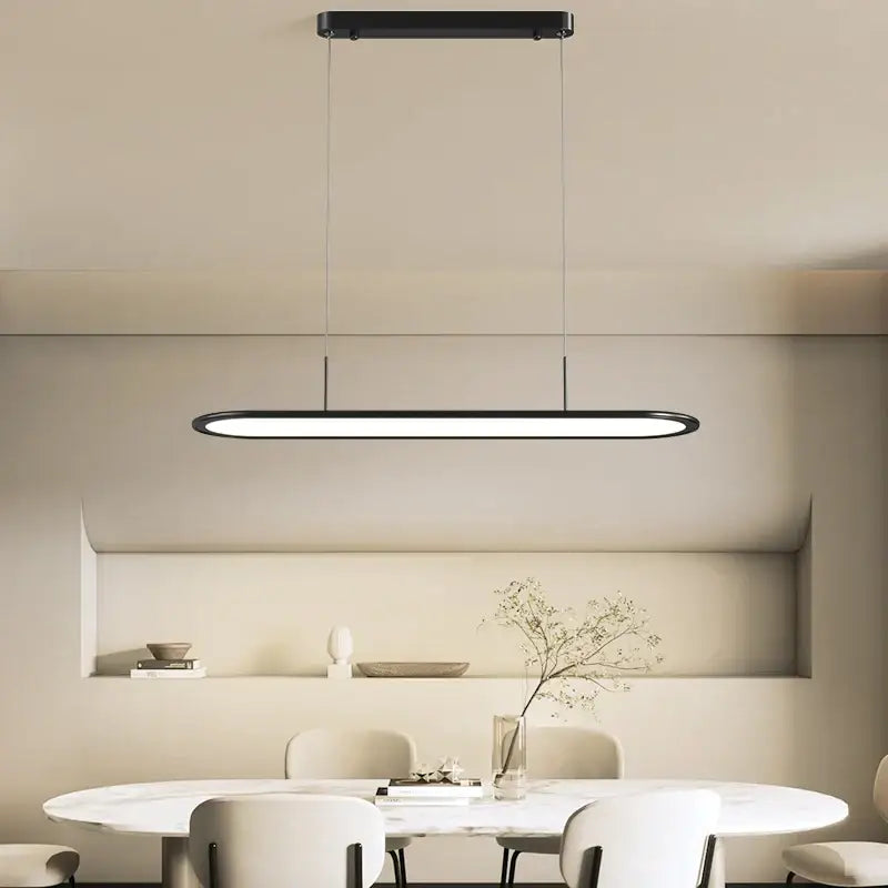 Modern black rectangular decorbites led pendant light with minimalist design hanging above dining table for indoor lighting