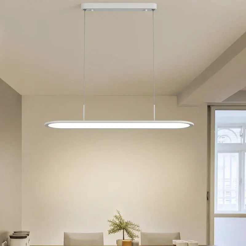 Modern white rectangular DecorBites LED pendant lights with sleek minimalist design and thin hanging cords for indoor lighting