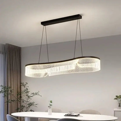 Modern black-framed DecorBites LED pendant lights with curved design and cascading clear crystal strands for indoor lighting