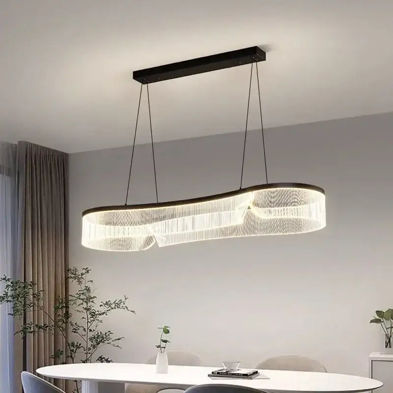Modern black-framed DecorBites LED pendant lights with curved design and cascading clear crystal strands for indoor lighting