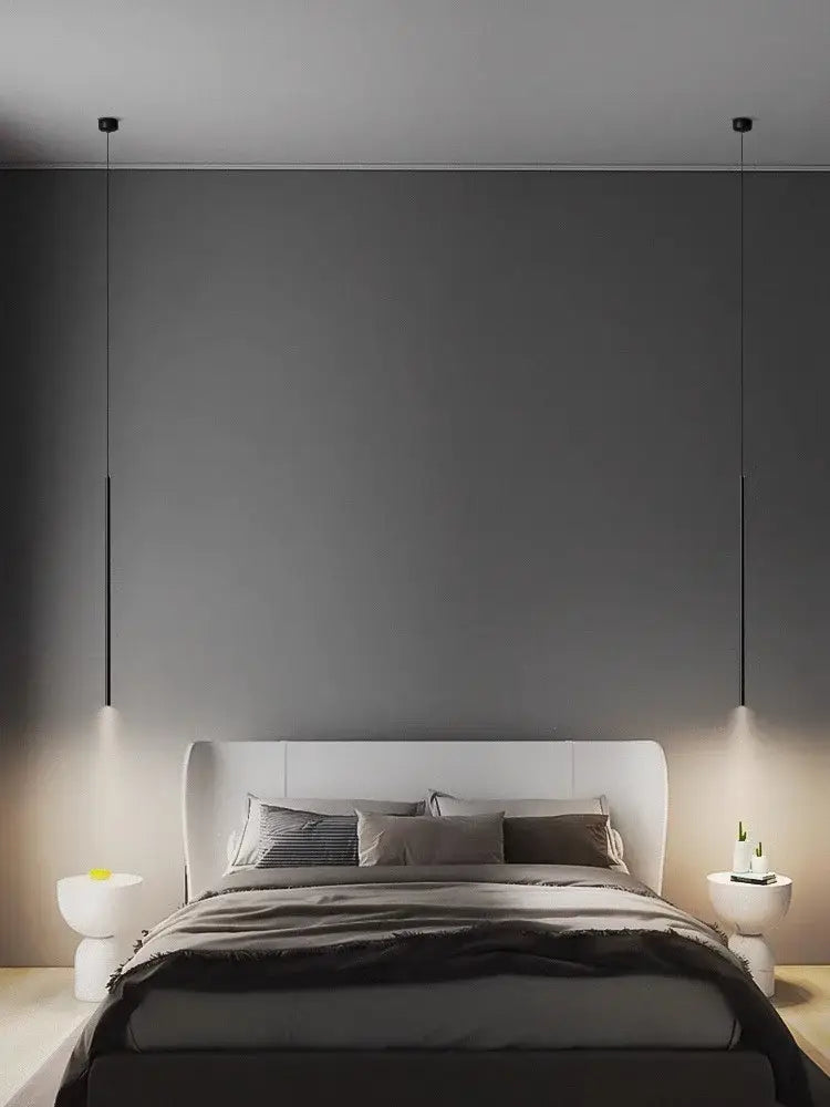 Minimalist white bed with modern headboard and matching nightstands featuring decorbites led pendant lights