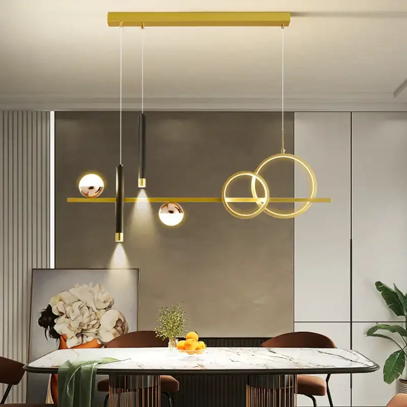 Modern gold-toned decorbites led pendant light with geometric rings and spherical bulbs for kitchen and office use