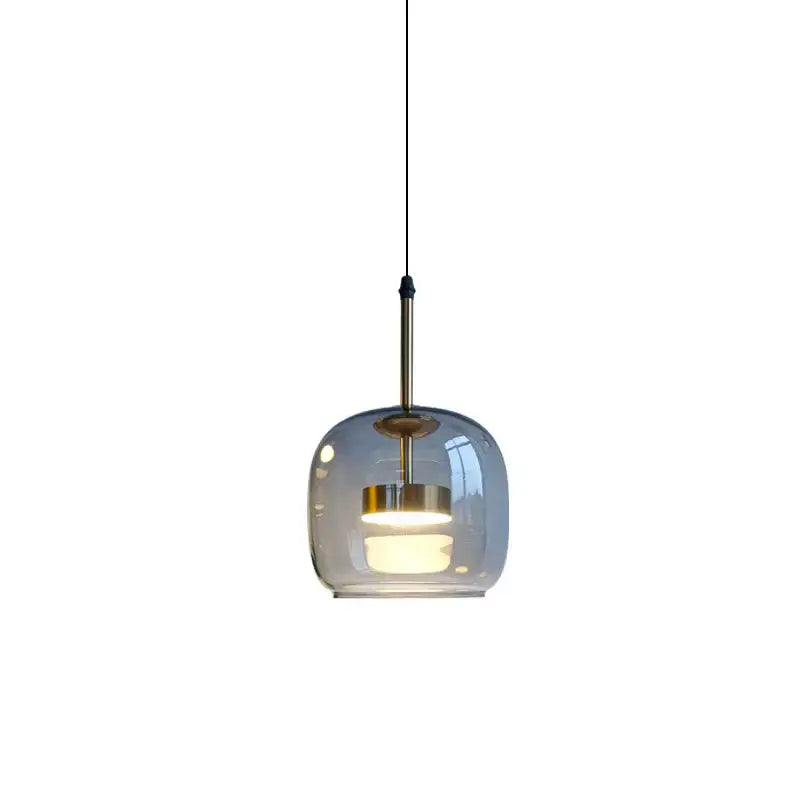 A modern DecorBites led pendant light with frosted glass globe and brass accents for stylish home decor