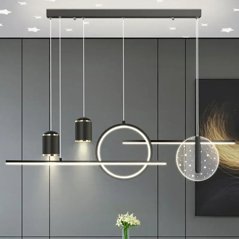 Modern black and gold decorbites led pendant lights with circular and cylindrical led elements for home living spaces
