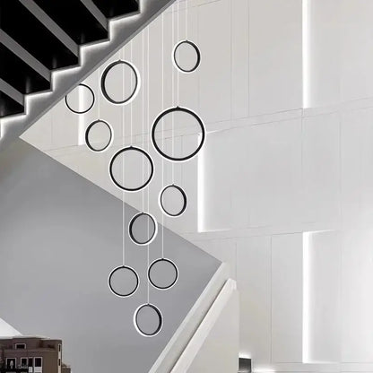 Modern black and white decorbites led pendant lights with circular design hang in cascading arrangement for living room
