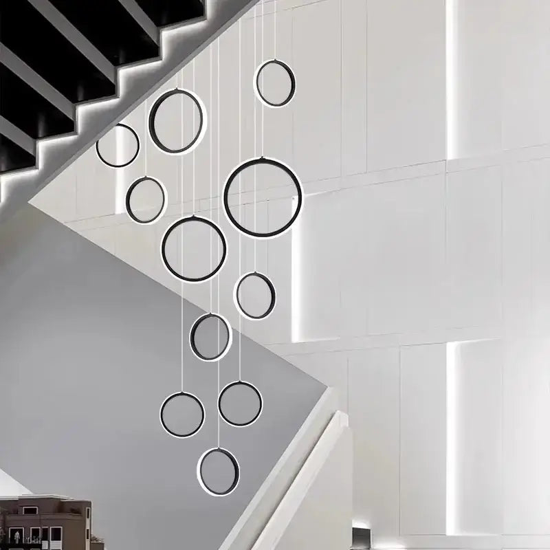 Modern black and white decorbites led pendant lights with circular design hang in cascading arrangement for living room