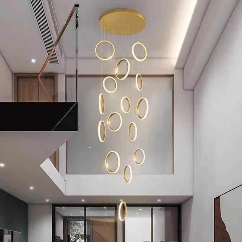 Golden circular pendant lights with illuminated rings suspended from central disc by DecorBites led pendant lights