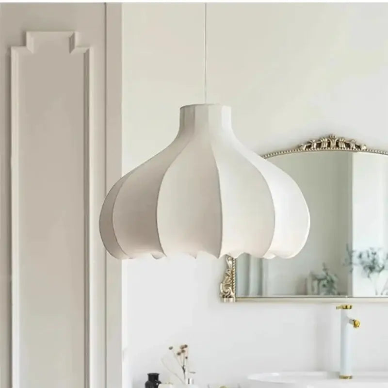A white petal-shaped decorbites led pendant light with soft diffused glow for elegant home lighting