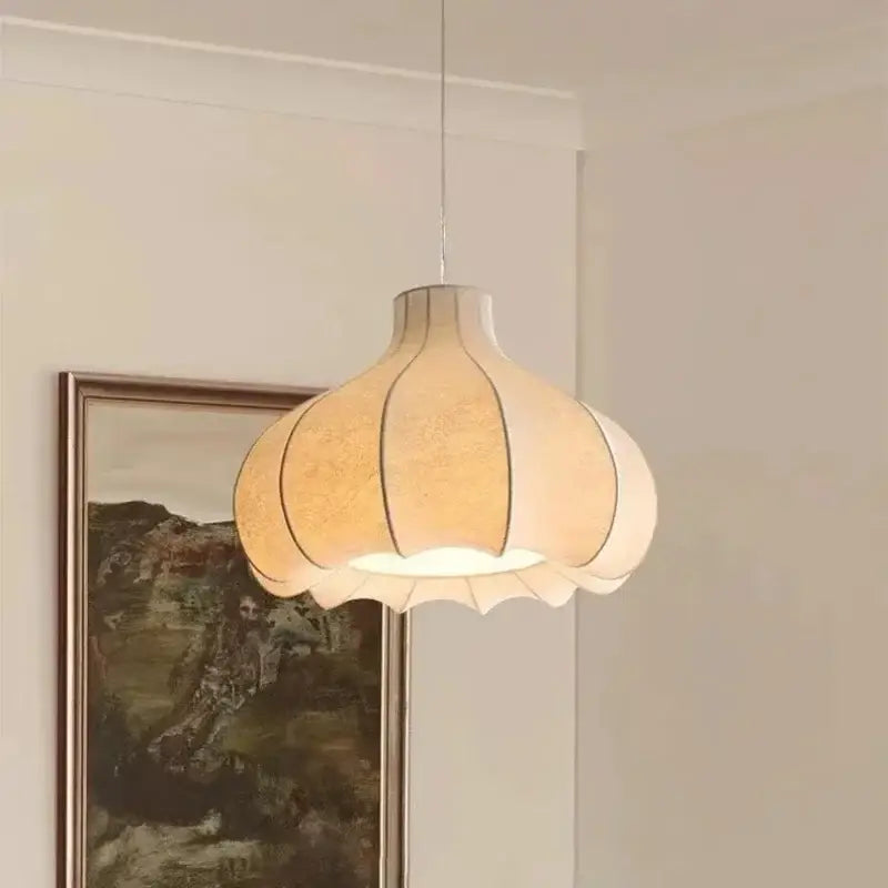 A warm-toned pleated paper decorbites led pendant light with a soft glow enhancing home lighting brilliance