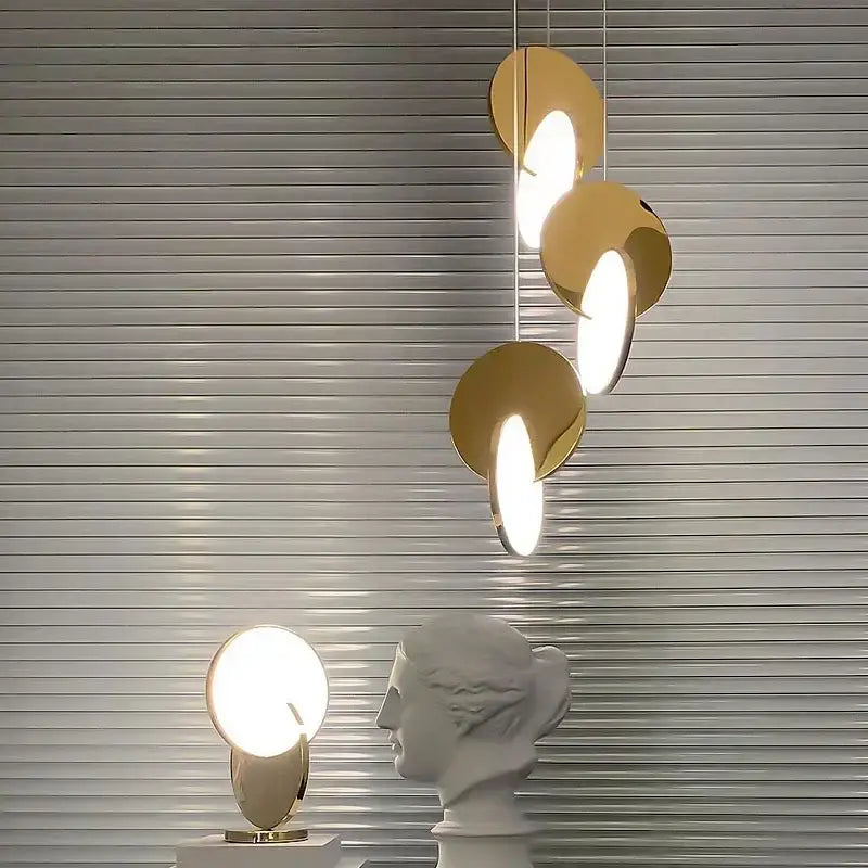 Modern gold-toned circular DecorBites LED pendant light with overlapping disc elements for home decoration