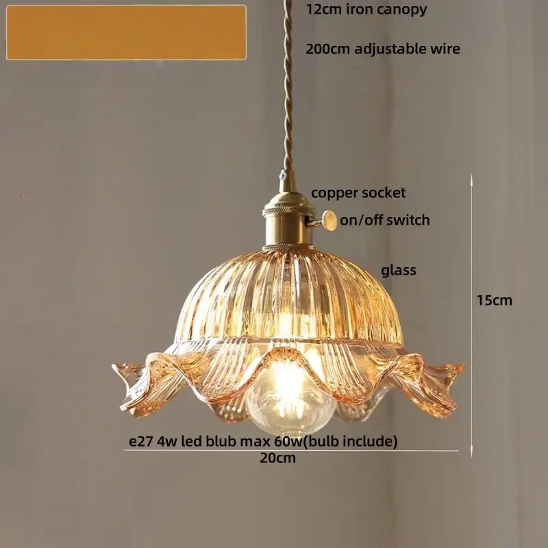 A warm amber glass pendant light with fluted petal design and brass hardware from DecorBites led pendant lights