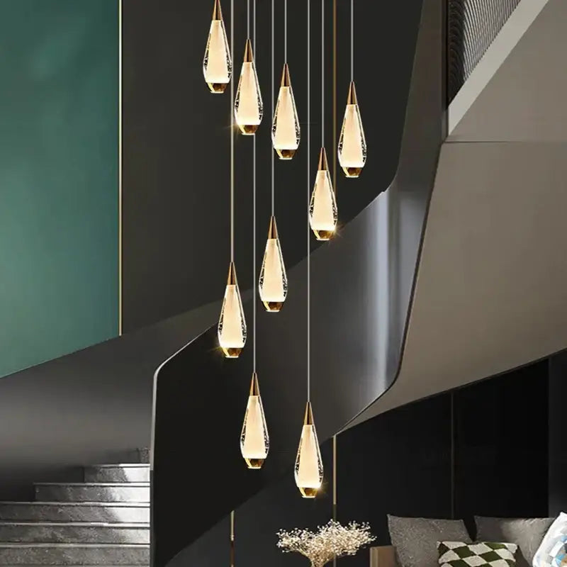 DecorBites led pendant staircase chandelier with ten teardrop crystal pendants and gold-toned caps for indoor lighting