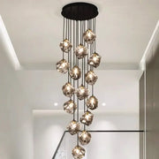 A modern DecorBites LED pendant light with irregular translucent glass orbs hanging from a black ceiling mount ideal for staircase lighting