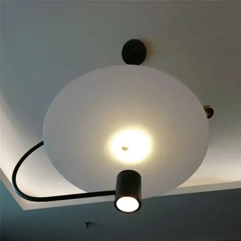 DecorBites™ LED pendant light fixture with frosted white spherical shade and black cylindrical arm for indoor lighting