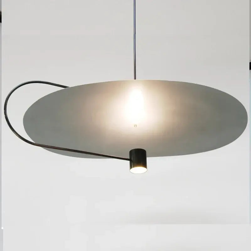 Modern minimalist decorbites led pendant light fixture with matte gray circular shade and black metal frame for indoor use